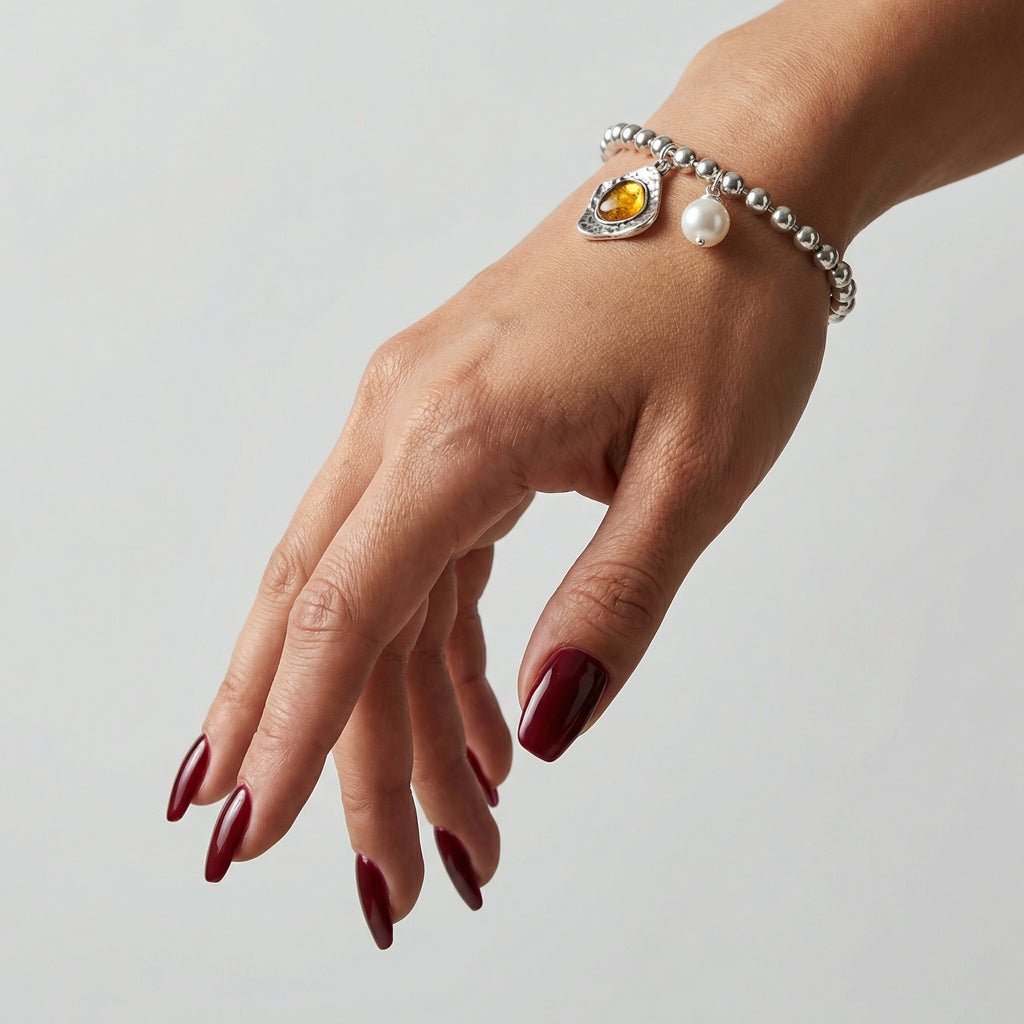 Pulsera Alma bolitas y charms